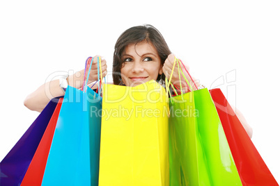 Beautiful shopping woman holding bags isolated over white backgr