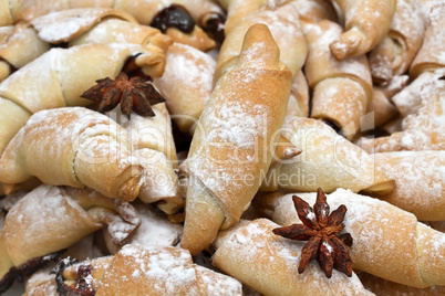 Freshly baked croissants with powdered sugar.