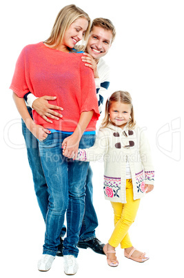 Two young parents with pretty daughter