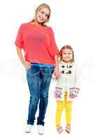 Mum and daughter posing in trendy outfits