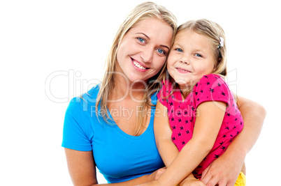 Adorable mom and daughter posing together