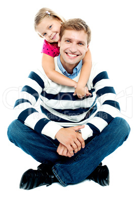 Daughter holding her father from behind