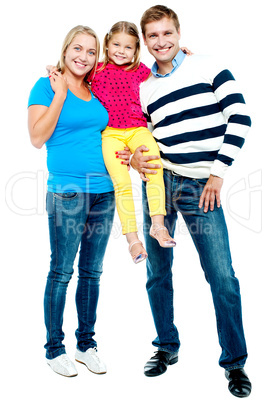 Full length portrait of a cheerful family of three