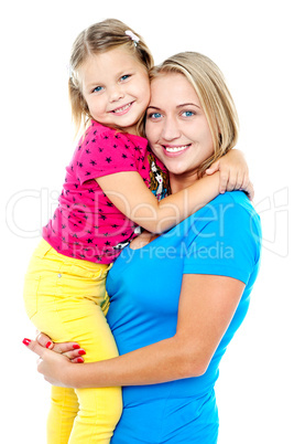 Cute daughter hugging her mom. Casual shot