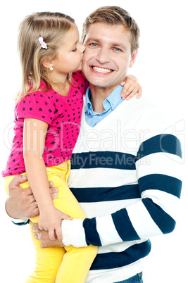 Sweet daughter kissing her smiling father