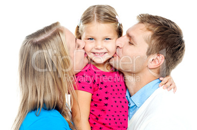 Mom and dad kissing their beautiful kid