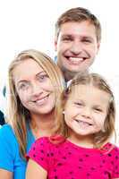 Husband posing with his adorable wife and daughter