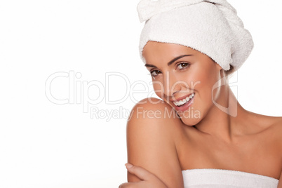 Beautiful woman wrapped in bath towels