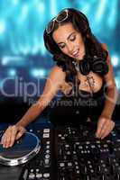 Sexy curvy DJ mixing music
