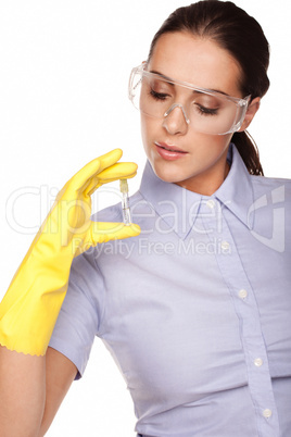 Medical technologist looking at a test tube