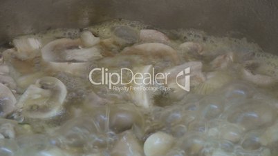 Boiling food, button mushrooms