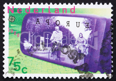 Postage stamp Netherlands 1988 Cyclists seen through car-door mi