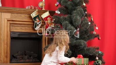 A girl under a Christmas tree