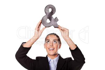 Businesswoman holding up an ampersand