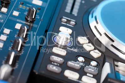 Closeup detail of a DJs deck with turntable