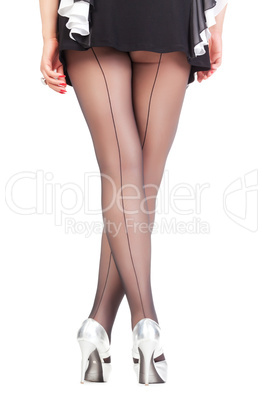 Sexy stylish legs in black sheer stockings
