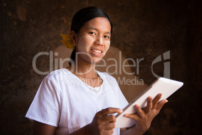 Myanmar girl using tablet computer