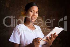 Myanmar girl using tablet computer