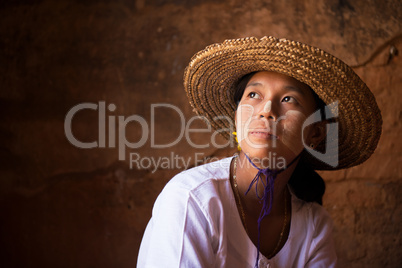 Myanmar girl in straw hot looking away