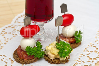 Canape with a mozzarella and tomatoes
