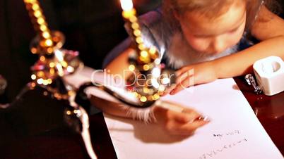 Girl writing with quill pen. Xmas concept