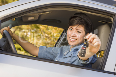 Happy Mixed Race Woman in Car Holding Keys