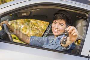 Happy Mixed Race Woman in Car Holding Keys
