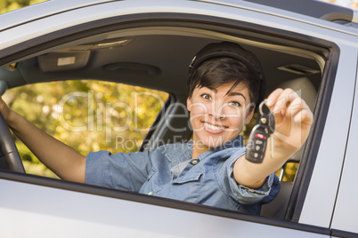 Happy Mixed Race Woman in Car Holding Keys