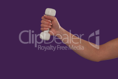 Female hand holding a dumbbell