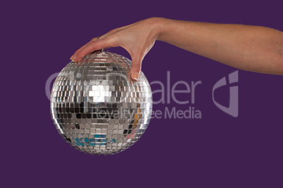 Female hand holding a disco ball