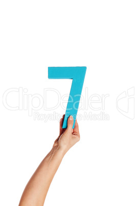 hand holding up the number seven from the bottom