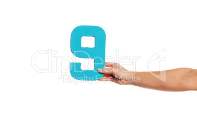 hand holding up the number nine from the right