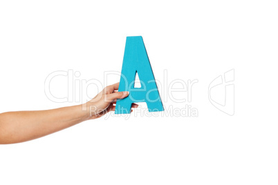 hand holding up the letter A from the left