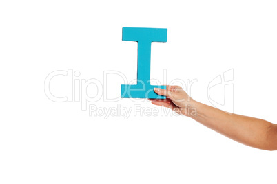 hand holding up the letter I from the right