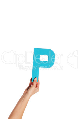 hand holding up the letter P from the bottom