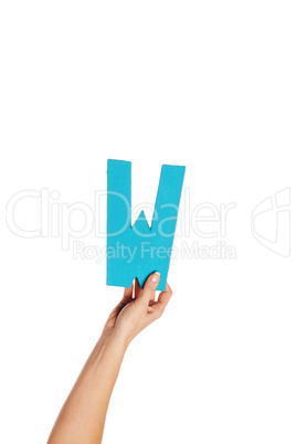 hand holding up the letter W from the bottom