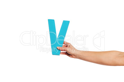 hand holding up the letter V from the right