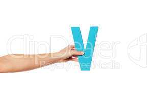 hand holding up the letter V from the left
