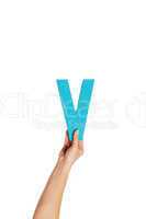 hand holding up the letter V from the bottom