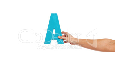 hand holding up the letter A from the right