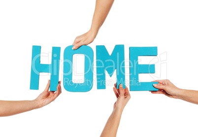 Female hands holding letters HOME