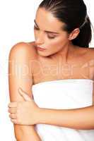 Beautiful woman caressing her arm