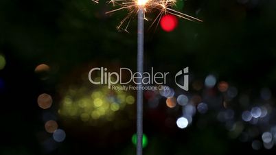 Christmas tree, mirror ball and lit sparkler