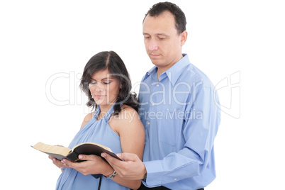 Attractive couple reading the Bible