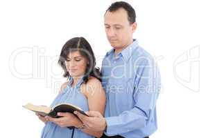 Attractive couple reading the Bible