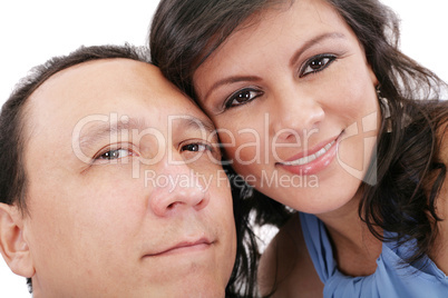 Closeup portrait of a sweet young couple smiling together