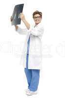 Smiling middle aged doctor holding up x-ray sheet