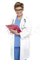 Female doctor with a case file in her hand