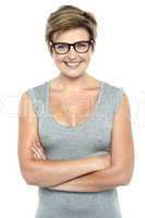 Bespectacled lady posing with confidence
