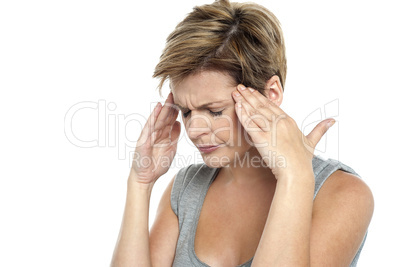 Woman having headache. Holding her head